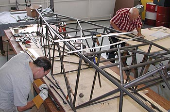 Mark Eckenrod and Curtis work on the Pitts Model 14 prototype in late June 2003